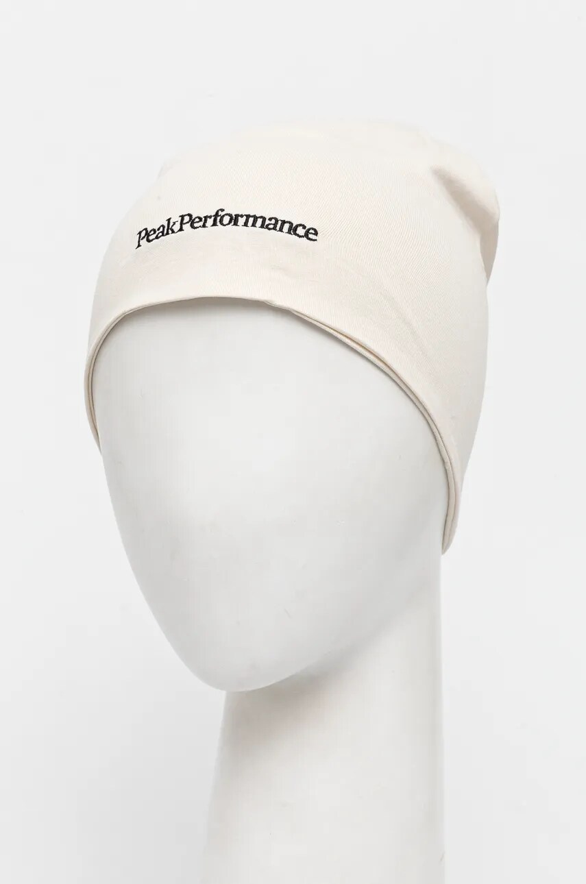 Бавовняна шапка Peak Performance колір бежевий з тонкого трикотажу з бавовни