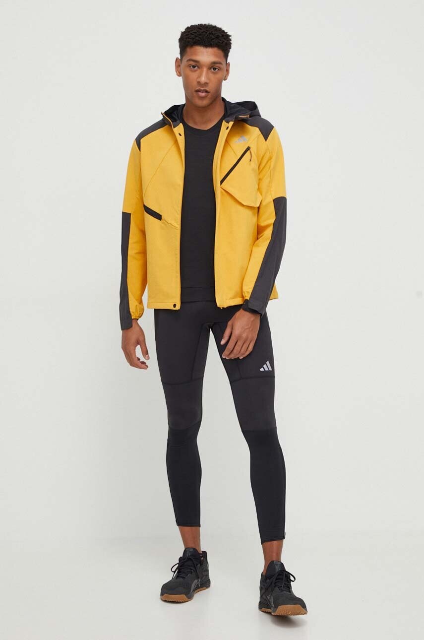 Бігова куртка adidas Performance колір жовтий перехідна