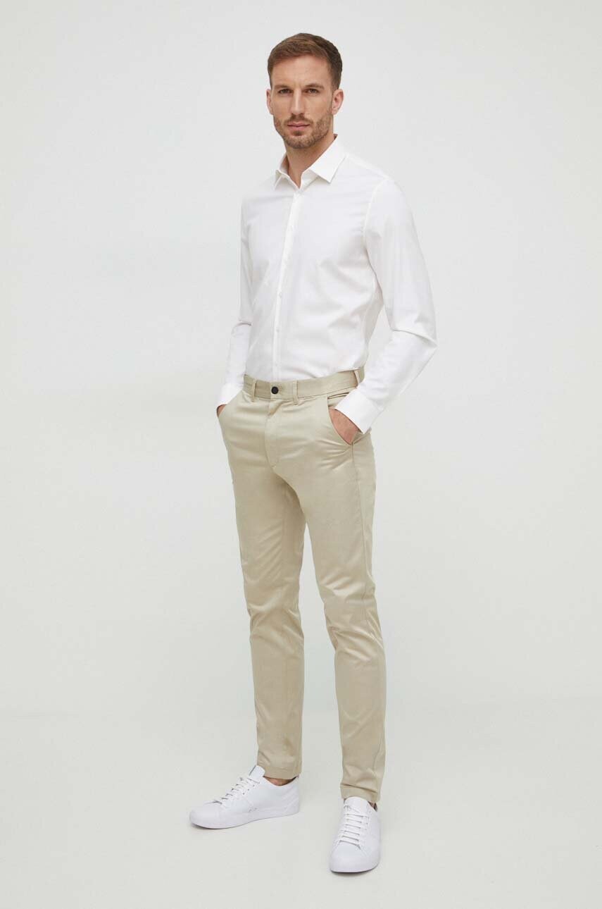 Штани Calvin Klein чоловічі колір бежевий фасон chinos