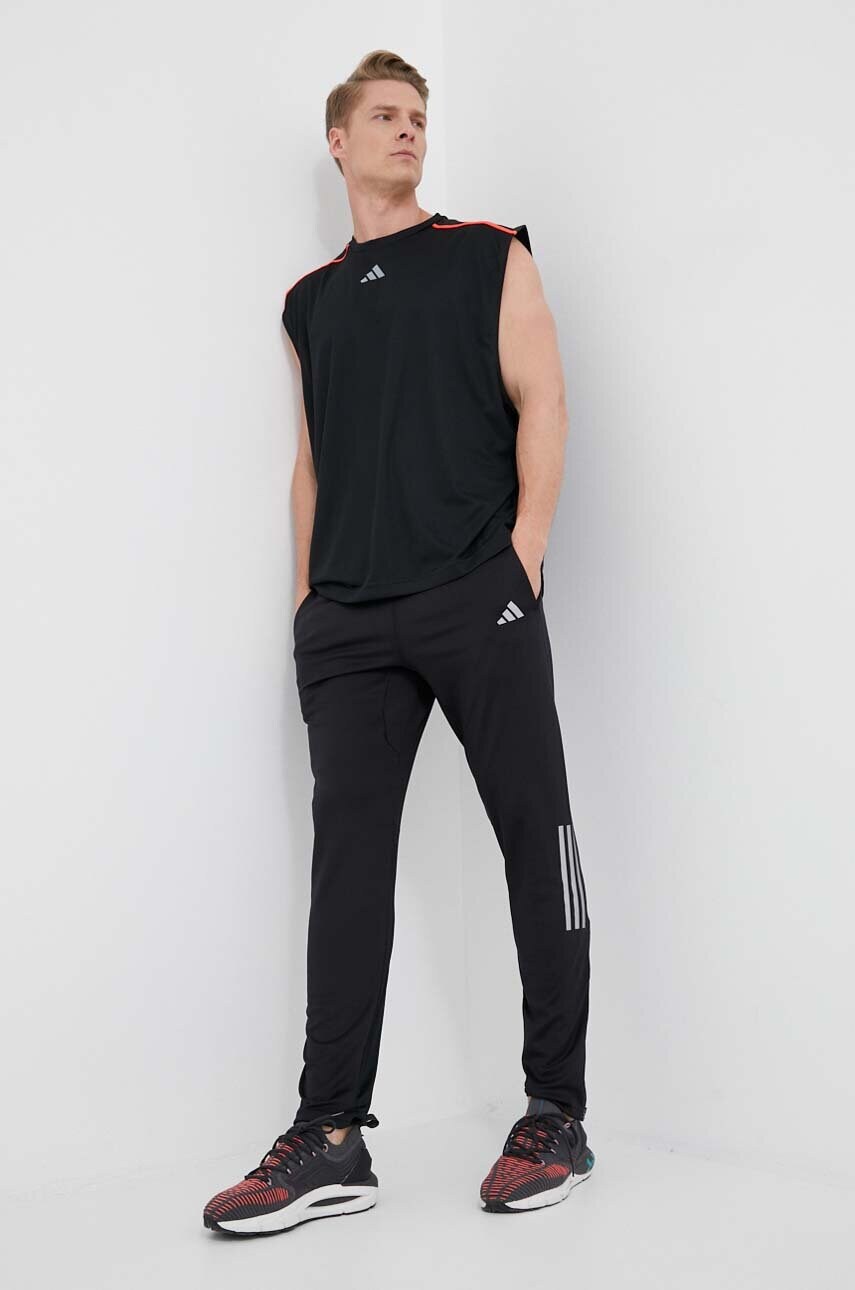 Штани для бігу adidas Performance Own the Run колір чорний з принтом
