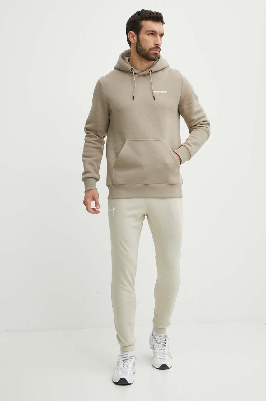 Спортивні штани Under Armour колір бежевий з принтом