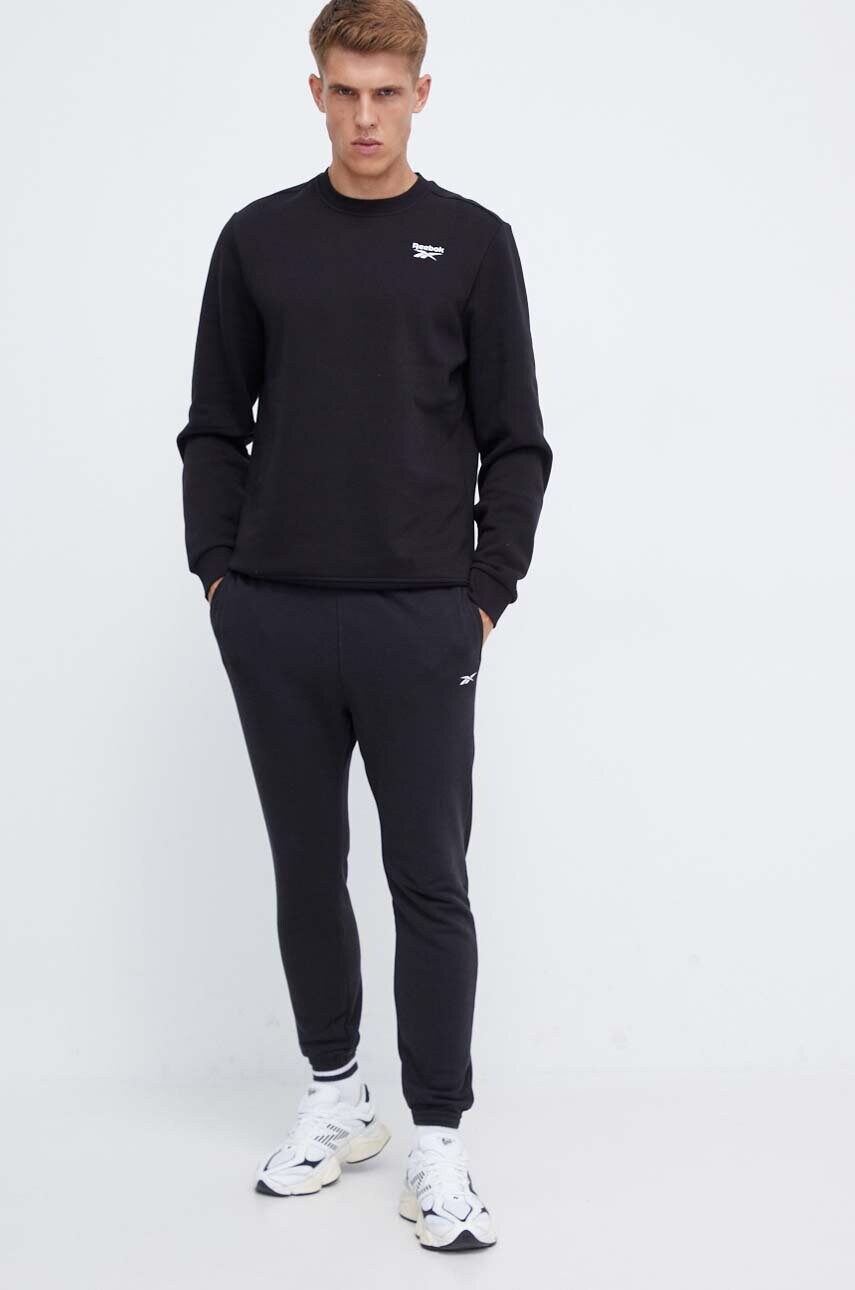 Штани Reebok чоловічі колір чорний однотонні