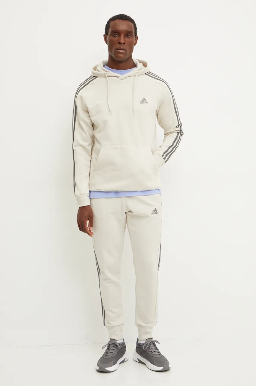 Бавовняні спортивні штани adidas Essentials колір бежевий візерунок IW7682
