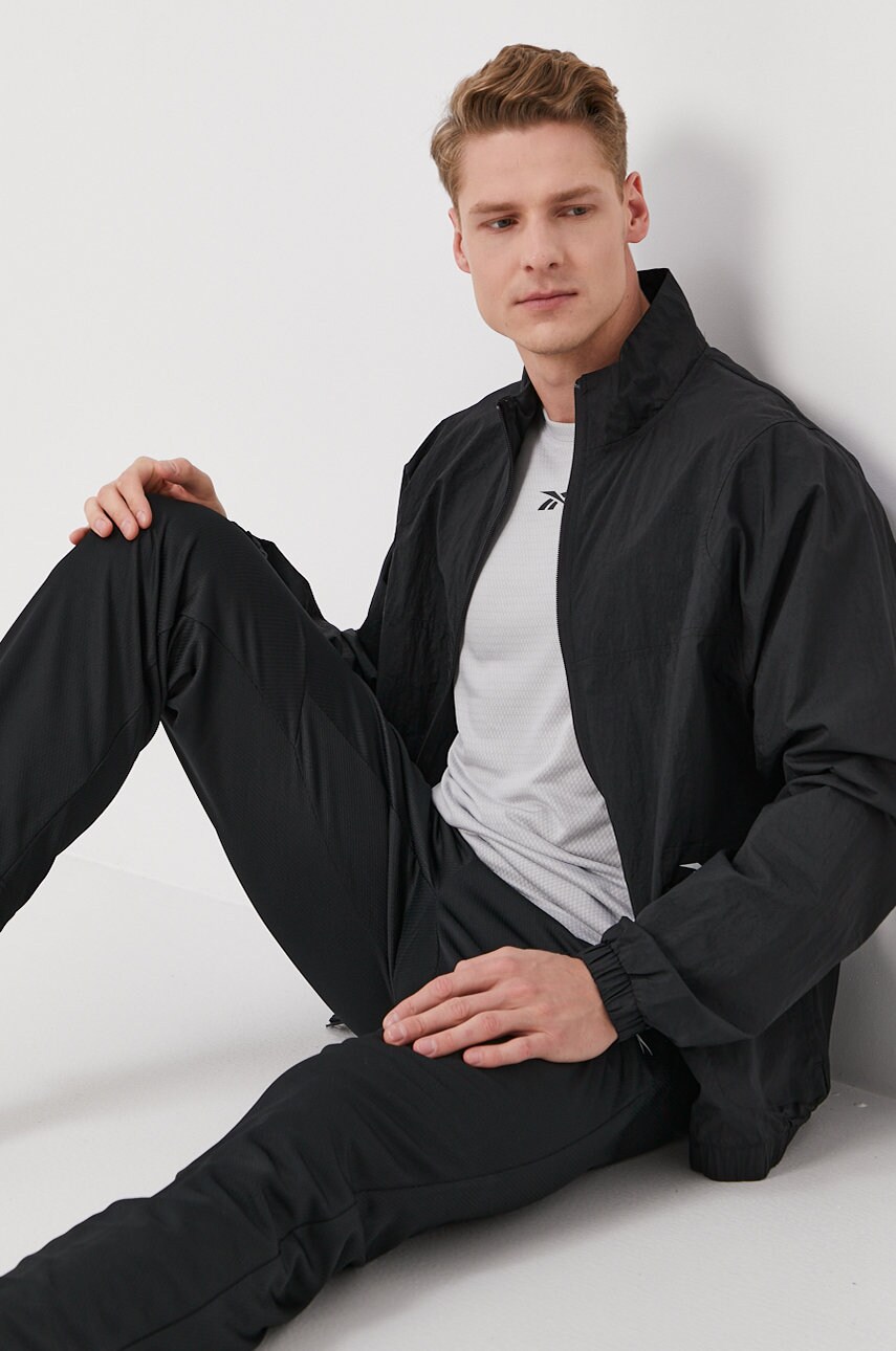 Штани Reebok FP9120 чоловічі колір чорний гладке