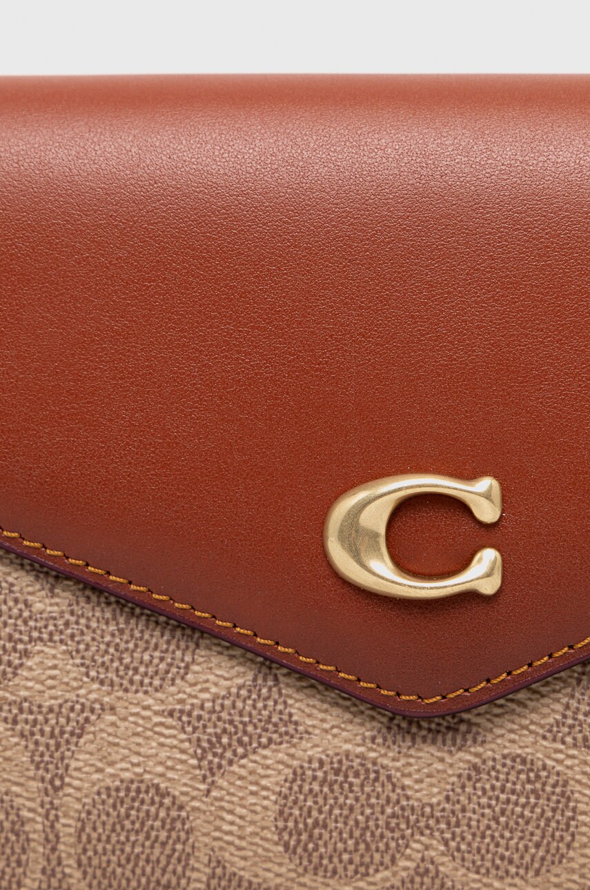 Шкіряна сумочка Coach колір коричневий