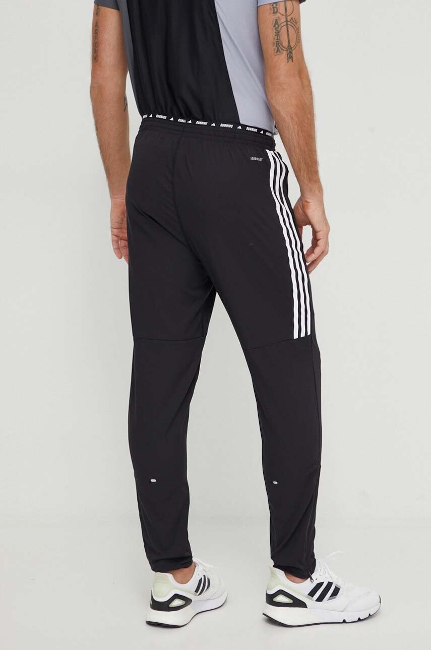 Штани для бігу adidas Performance Own the Run колір чорний з принтом