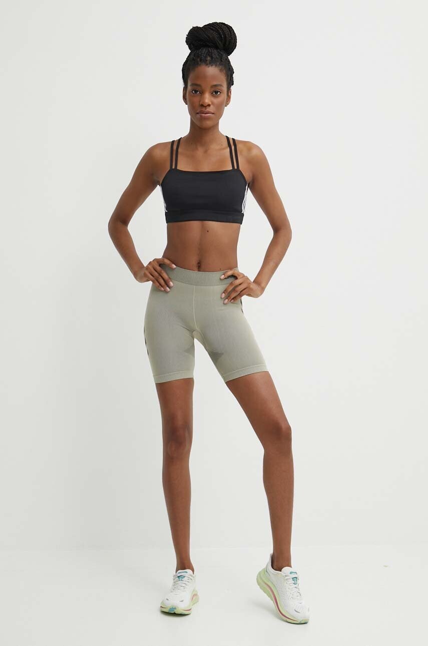 Шорти для тренувань Hummel First Seamless колір бежевий з принтом висока посадка 212556