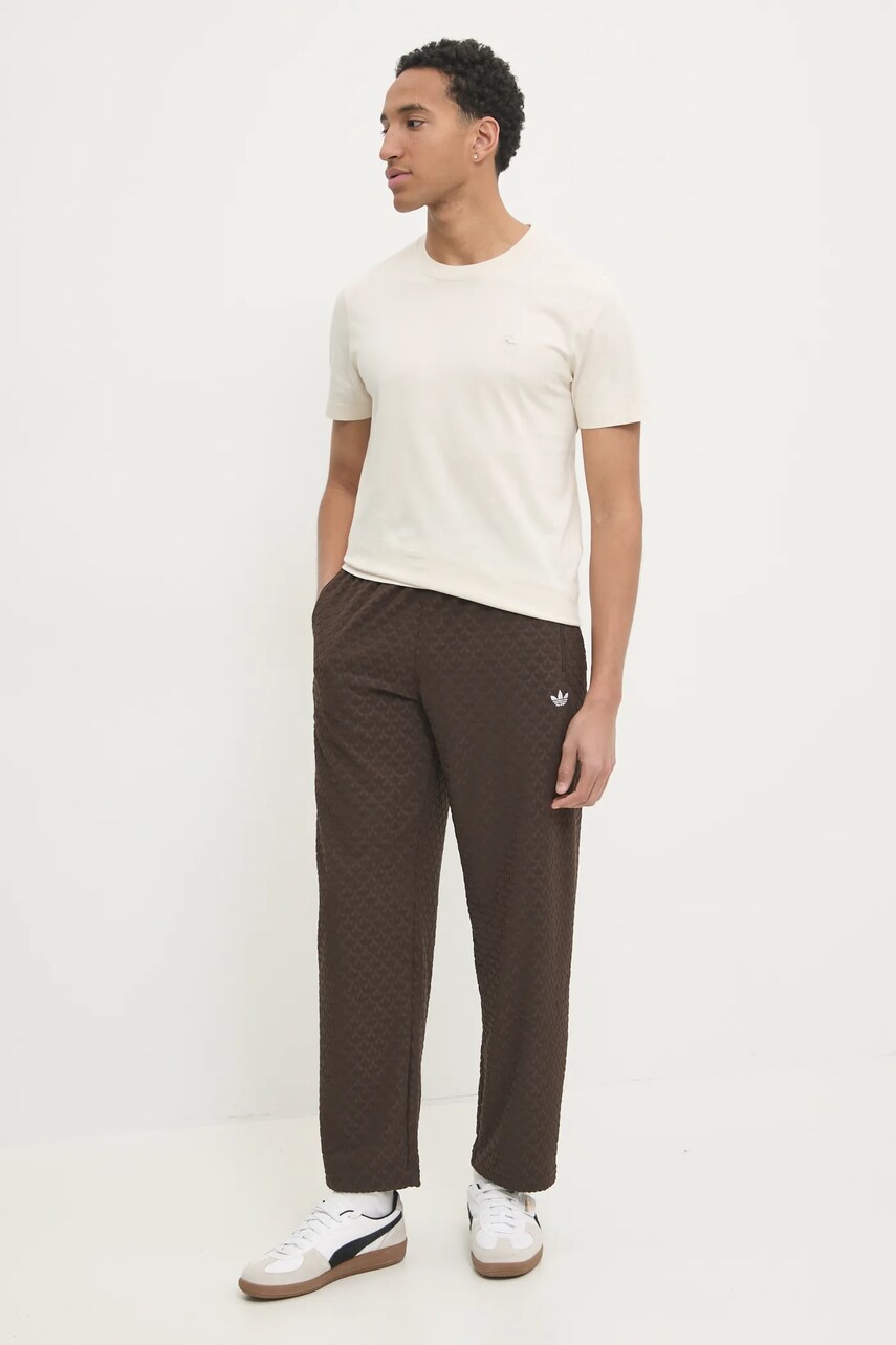Спортивні штани adidas Originals Q12 MONOGRAM TR колір коричневий однотонні JP4428