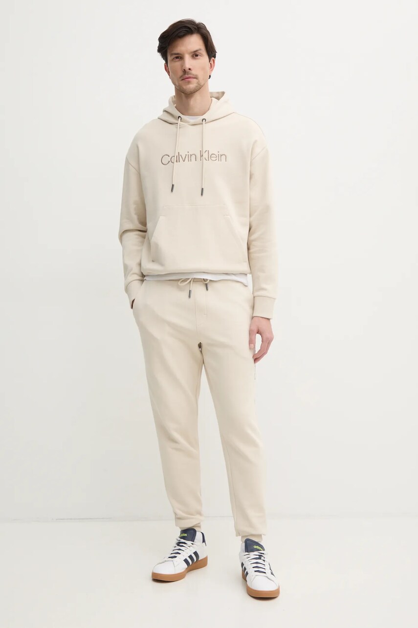 Бавовняні спортивні штани Calvin Klein колір бежевий з аплікацією K10K114254
